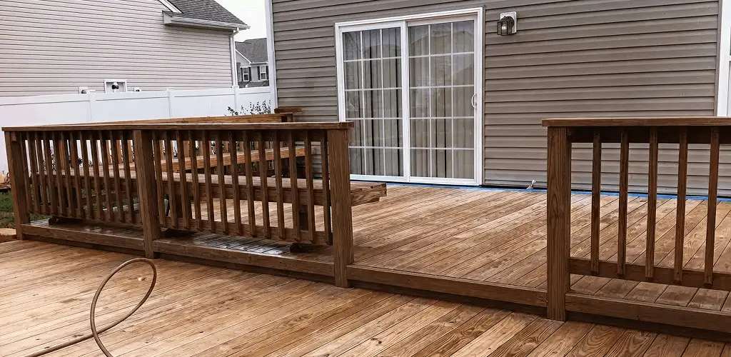 Deck sealing service protecting a backyard wood deck and railings in Philadelphia, PA