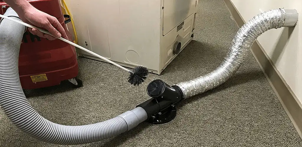 Dryer vent cleaning service removing lint from a dryer duct connection in Philadelphia, PA