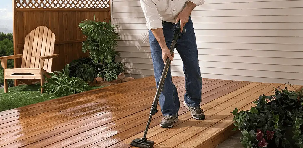 Deck staining service applying stain to a backyard wood deck in Philadelphia, PA